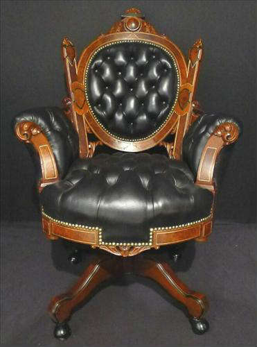 288 - Large Walnut Victorian Office Desk chair, padded arms, carved  crown, black leather upholstery, ca. 1870