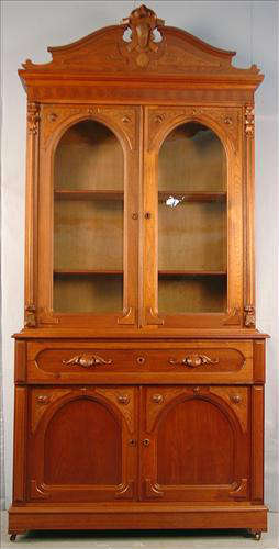 292 - Walnut Butlers Secretary, 2 upper glass doors, pullout writing surface with pigeon holes, carved crest, 2 lower doors, 8ft. 7in. T, 49in. W, 19in. D.