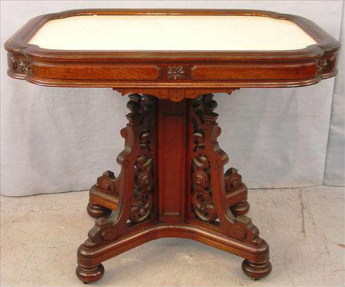 298 - Victorian Rectangular Parlor Table, Pierce carving with insert white marble top, square center pedestal with 4 legs, 29in. T, 36in. W, 26in. D.