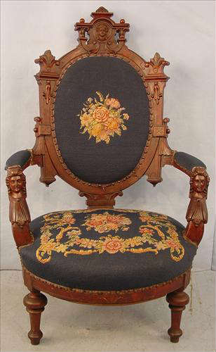 299 - Victorian John Jelliff Gentleman's Walnut Arm Chair, lady heads carved on arm supports, ornate crest on back, needlepoint, 46in. T, 25in. W, 24in. D.
