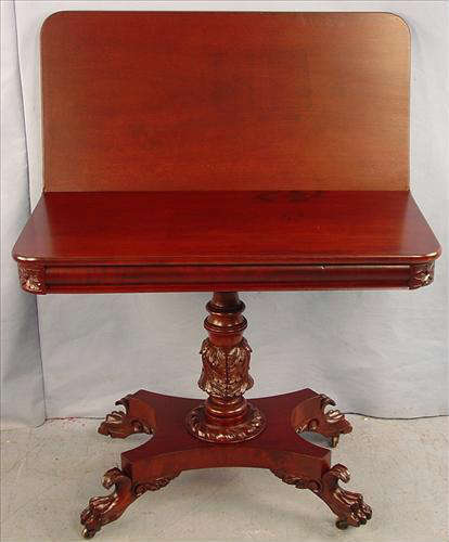 322 - Mahogany Game Table, 29in. T, 36in. W, 18in. D. with acanthus caved base and claw feet.