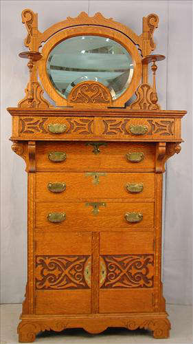 343 - Large Solid Oak Gentleman's Chest, carved doors at bottom and on top drawers, has original bevel mirror with carved frame, 79in. T, 38in. W, 22in. D, ca. 1900.
