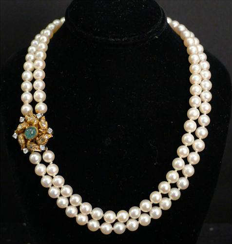 364 - Double Strand of Pearls with gold clasp, emeralds and diamonds.