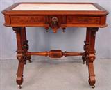 377 - Victorian Renaissance Parlor Table, recessed white marble top, 2 large ladies heads, 10 finials, burled panels, ca. 1875, 30in. T, 36in. W, 22in. D.