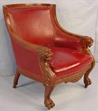 385 - Mahogany Arm Parlor Chair with carved loins head on arms, claw feet, red upholstery, att. to Horner, ca. 1900.
