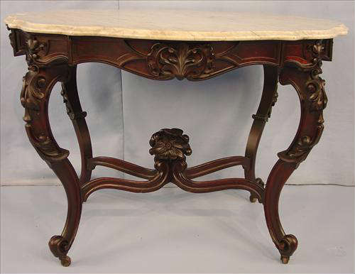 388 - Walnut Rococo Turtle Top Parlor Table with white marble, has bouquet finial, marble has damage, 29in. T, 41in. W, 30in. D.