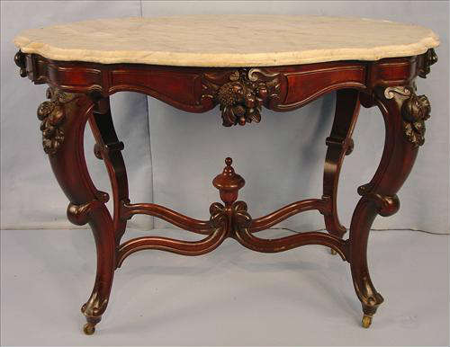 392 - Walnut Victorian Turtle Top Parlor Table, original finish fruit carved on sides, ends and legs, 29in. T, 41in. W, 29in. D.
