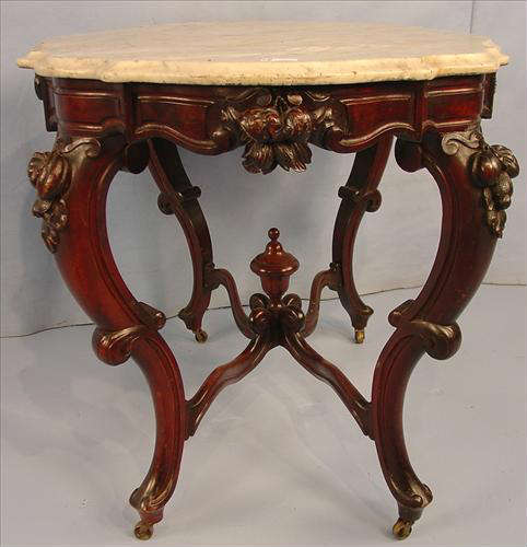 392 - Walnut Victorian Turtle Top Parlor Table, original finish fruit carved on sides, ends and legs, 29in. T, 41in. W, 29in. D.
