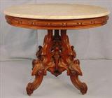 396 - Oval Walnut Victorian center Parlor Table, heavily carved base, att. Thomas Brooks, 30in. T, 37in. W, 29in. D.