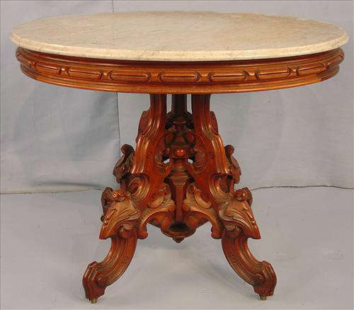 396 - Oval Walnut Victorian center Parlor Table, heavily carved base, att. Thomas Brooks, 30in. T, 37in. W, 29in. D.
