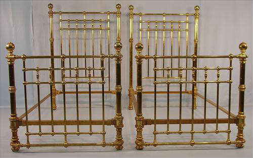 399 - Pair of Heavy Brass and Iron Twin Beds, high head boards, curved foot boards, ca. 1880, 66in T, 40in. W, 74in. L.