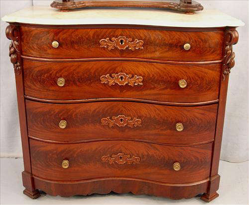 426 - Flame Mahogany Victorian Marble Top Chest with serpentine front and fruit carved corners, ca. 1850, 37in. T, 42in. W, 23in. D. ca. 1850.