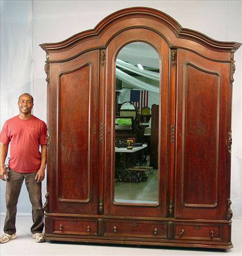 476 - Hugh Walnut Victorian 3 Door Wardrobe with mirrored center door, original finish, 8ft 8in T, 81in. W, 21in. D. Ca. 1860.
