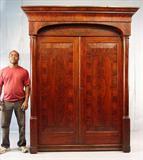 477 - Flamed Mahogany Empire 2 door Wardrobe with column front, 94in. T, 65in. W. 28in. D. ca. 1840.