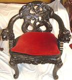 143 - Teakwood, Opium Chair with ivory eyes and dragon-carved arms