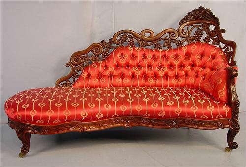 100 - Rosewood laminated rococo recamier by J.H. Belter, fountain elm pattern, red and gold Victorian silk upholstery, 41in. T, 68in. W. 27in. D, ca. 1850.