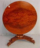 101 - Period mahogany empire tilt top table with large claw feet, match veneer top, ca. 1840, 38in. Dia., round base.