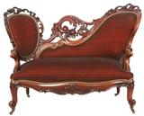 105 - Mahogany rococo courting love seat with pierced carved back and crown, 59in. L, 29in. T, 27in. D, unusual shape, ca. 1860.