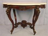 108 - Rosewood turtle top parlor table with original white marble, roses carved in finial, nuts carved on knee of leg, 48in. L, 27in. W, ca. 1850.