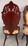 208 - Pair of rosewood laminated rococo side parlor chairs by Meeks, Hawkins pattern, 43in. T, 19in. W, 19in. D. with striped upholstery. Back view of parlor chairs.