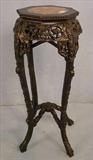 309 - Carved oriental plant stand with marble insert top, ebonized, 36in. T, 14in. Dia.