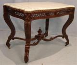 251 - Rosewood laminated skirt marble top parlor table, pierced carving around skirt, att. to Meeks, 30in. T, 39in. L, 25in. D., ca. 1850.