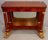 253 - Period empire game table with pier base with brass and banded inlay, large claw feet, 32in. T, 39in. L, 20in. D., ca. 1850