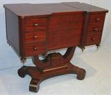 254 - Mahogany empire double sewing stand with yolk base, 28in., 32in. L, 17in. D. ca. 1880.