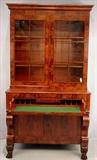 258 - Period mahogany empire secretary desk with individual glass paneled door, claw feet, 86in. T, 49in. W, 25in. D, ca. 1840
