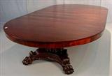 263 - Outstanding oversized mahogany empire banquet table with large claw feet and cluster column base, 72in. Dia. with 6 original 12in. Leaves, ca. 1880