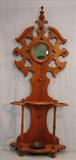 343 - Walnut Victorian hall tree with small round mirror, 85in. T, 33in. W, 12in. D., ca. 1875.