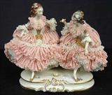 619 - Dresden double figure, figurine of two girls in pink lace dresses, 10in. T, 13in. L, ca. 1900