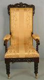 469 - Rosewood hi back parlor chair with acanthus carved front legs, gold upholstery, 48in. T, 21in. W, 16in. D.