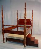 321 - Mahogany empire plantation 4 poster bed with trundle bed underneath, 87in. T, 78in. L, 53in. W, also has bed steps, ca. 1840.