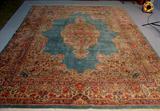 495 - Hand made wool Persian rug, blue center, 8ft 10in. X 12ft.