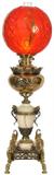 124 - Brass and onyx banquet lamp with heads attached to side, red shade, 9.5in. T, has been restored, waas oil, ca. 1880.