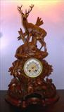127 - Black forest mantle clock with full body deer standing on top, 25in. T, 16in. W, great carving, ca. 1880.