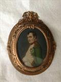 139 - Small painting of Napoleon in green coat, gold frame.