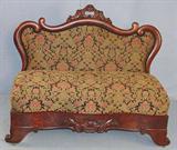 90 - Flame mahogany empire bustle bench with carved crown, 34in. T, 42in. W, 17in. D, ca. 1850.