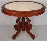 50 - Walnut victorian oval parlor center table with white marble, extra support design base, 29in. T, 36in. W, 28in. D, ca. 1860.