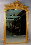 142b - Beautiful Victorian hanging gold leaf mirror, ca. 1860 with extra carving on crown. 54in. W, 84in. T.