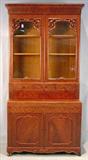 268 - Flamed mahogany empire secretary with carved doors and Birdseye maple interior, 94in. T, 47in. W, 21in. D.