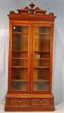 270 - Victorian walnut 2 door bookcase with carved pulls and crest, 8ft 9in T, 48in. W, 19in. D.