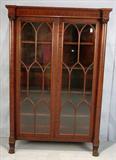 300 - Mah, empire china cabinet with column front and claw feet, individual glass panels in door 71in tall .48in wide, 16in deep ca,1880