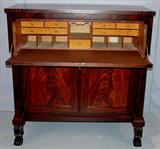 312 - Mahogany empire butlers desk with claw feet mah, doors 48in. tall, 48in. wide, 23in. deep.