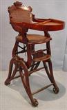 311 - Walnut Victorian convertble high chair stroller, 37in. tall , 13in. wide , 13in. deep.