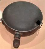 1311 - Metal canteen used by confederate army with bullet hole in one side.