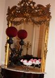 1200 - Rococo gold leaf over the mantle mirror in great condition, ca. 1860.