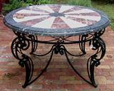 25 - Wrought iron table with specimen marble top.