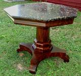 28 - Mahogany octagon marble top table, signed made in Baltimore, 27in. T, 37in. W.
